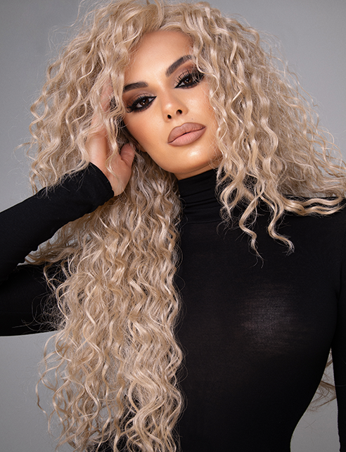 LORENA - 22" LAYERED CURLY SANDY BLONDE TONED LACE FRONT WIG